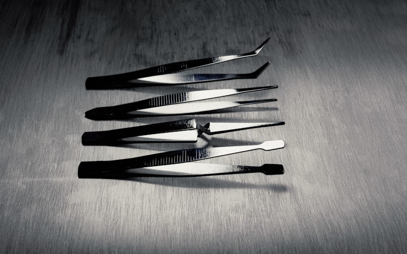 Close-up of chef's knife slicing through fresh vegetables on a wooden board