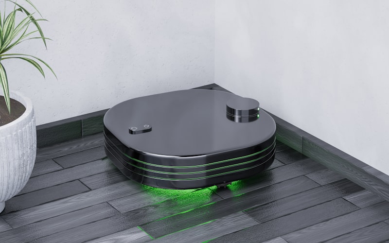 Close-up of a robot vacuum picking up pet hair from carpet