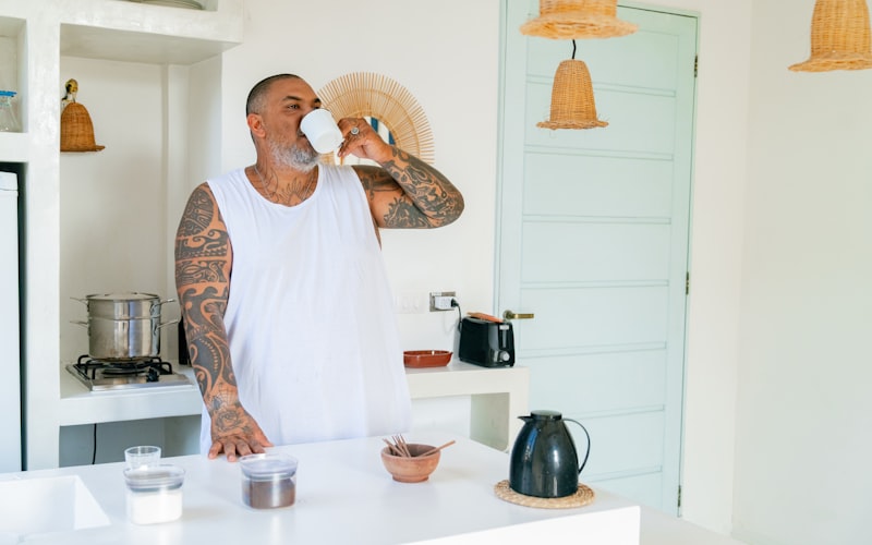 Close-up of a Keurig coffee maker with the water reservoir removed, showing the inside of the machine and the pod holder area