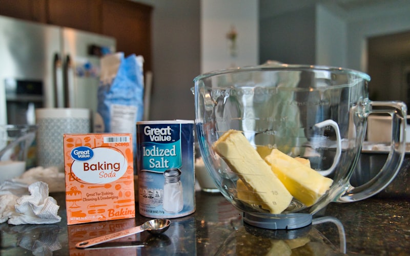 Before and after comparison of dirty grout vs clean grout on white bathroom tiles