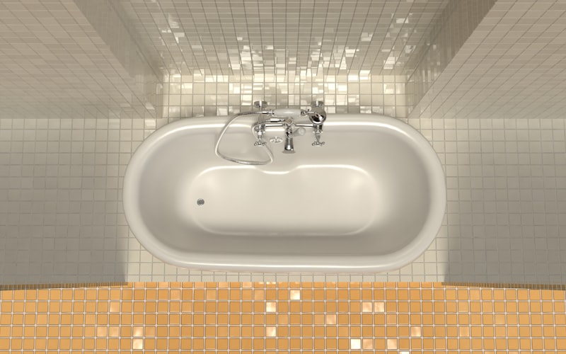 Person using a handheld steam cleaner on bathroom floor grout lines