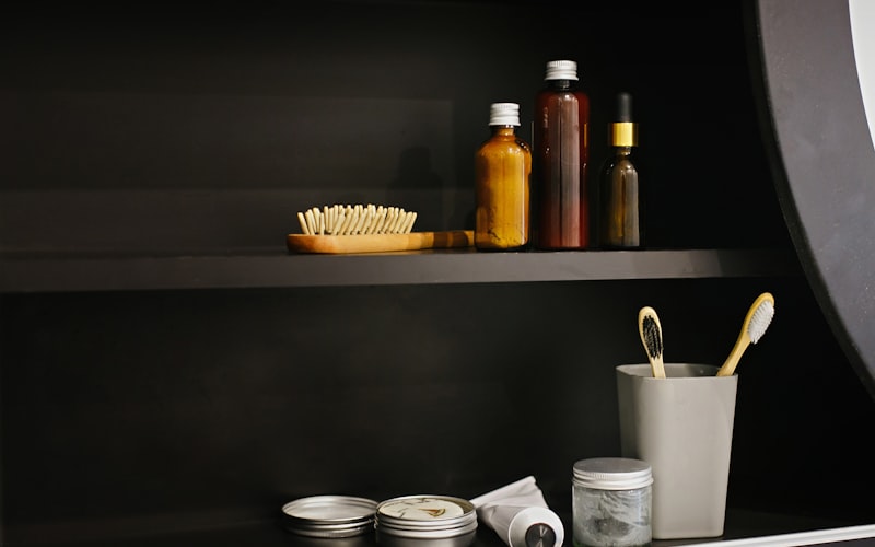 Neatly organized bathroom cabinet with bins and containers
