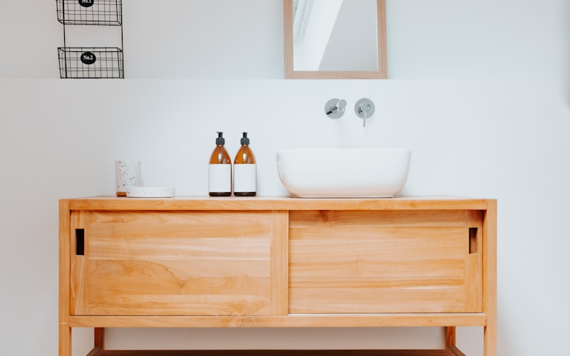 Small labeled bins organizing medications inside a medicine cabinet