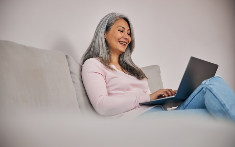 Homeowner reviewing insurance policy documents at kitchen table
