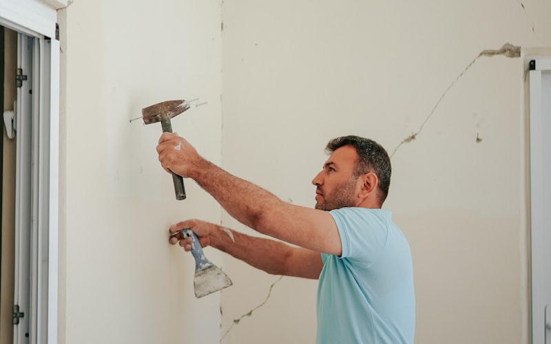 Hands using tools for a DIY home repair project