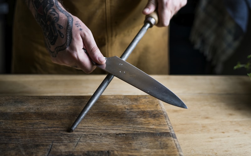 electric knife sharpener in action with safety features visible