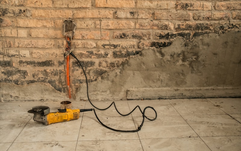 Drain snake being inserted into a bathroom sink drain